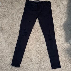 American Eagle black ripped super stretch jeans.